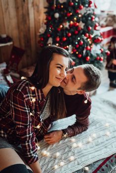 a guy and a girl celebrate the new year together
in a warm atmosphere and give each other gifts