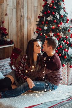 a guy and a girl celebrate the new year together
in a warm atmosphere and give each other gifts