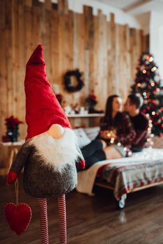 new year festive decorations in warm colors, christmas tree and christmas wreath