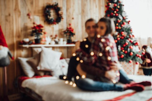 a guy and a girl celebrate the new year together
in a warm atmosphere and give each other gifts