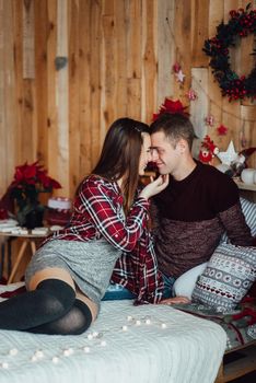 a guy and a girl celebrate the new year together
in a warm atmosphere and give each other gifts