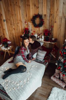 a guy and a girl celebrate the new year together
in a warm atmosphere and give each other gifts