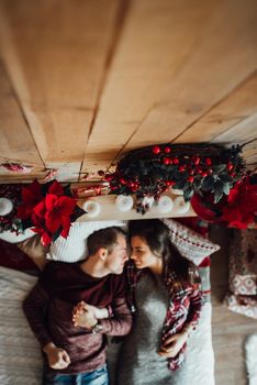 a guy and a girl celebrate the new year together
in a warm atmosphere and give each other gifts