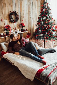 a guy and a girl celebrate the new year together
in a warm atmosphere and give each other gifts