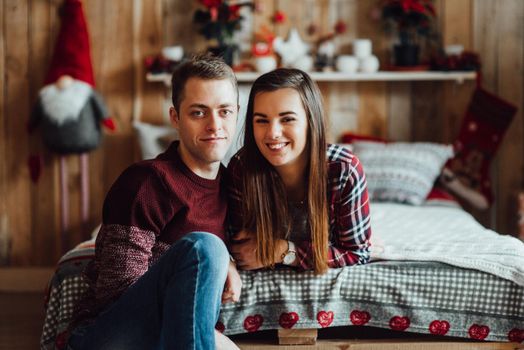 a guy and a girl celebrate the new year together
in a warm atmosphere and give each other gifts