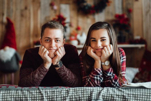 a guy and a girl celebrate the new year together
in a warm atmosphere and give each other gifts