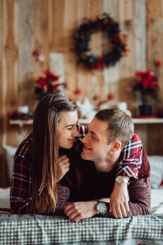 a guy and a girl celebrate the new year together
in a warm atmosphere and give each other gifts