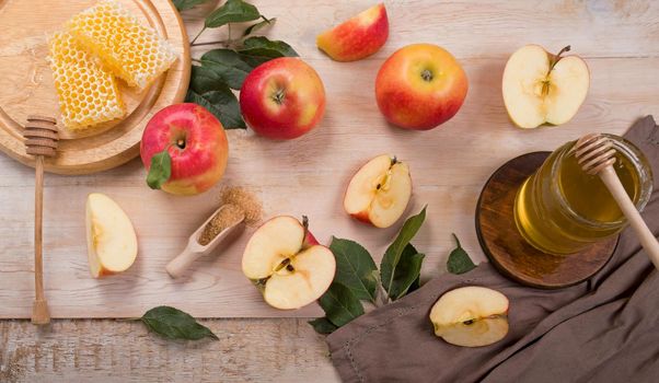 Jewish holiday Rosh Hashana background with apples, honey on blackboard. View from above. Flat lay