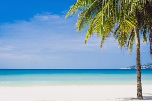 Tropical nature clean beach and white sand in summer season with sun light blue sky background.