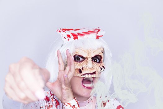Woman dressed as a killer nurse for Halloween night