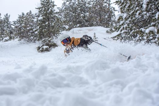 Young man skiing in the Pyrenees at the Grandvalira ski resort in Andorra in Covid19 time.