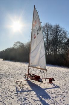 Iceboat runner ready for a ride  on a frozen lake