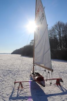 Iceboat runner ready for a ride  on a frozen lake