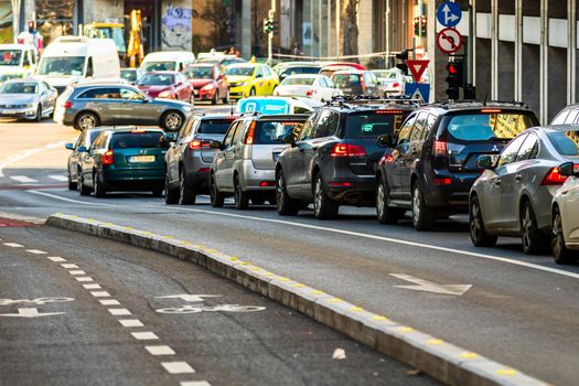 Car traffic at rush hour in downtown area of the city. Car pollution, traffic jam in the morning and evening in the capital city of Bucharest, Romania, 2021