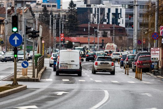 Car traffic at rush hour in downtown area of the city. Car pollution, traffic jam in the morning and evening in the capital city of Bucharest, Romania, 2021