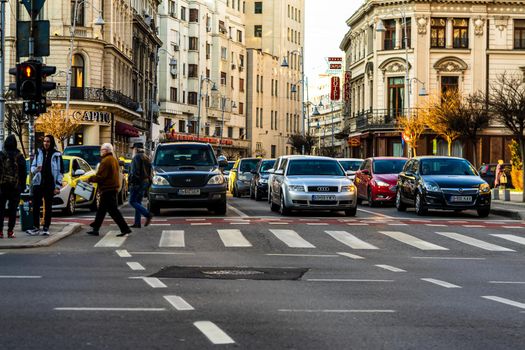 Car traffic at rush hour in downtown area of the city. Car pollution, traffic jam in the morning and evening in the capital city of Bucharest, Romania, 2021