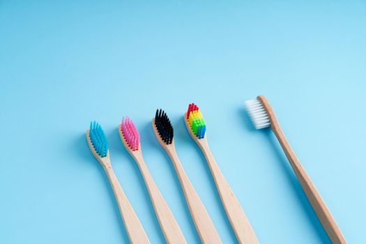 A bunch of eco-friendly bamboo toothbrushes. Global environmental trends. Gender and racial inequality. toothbrushes of different genders.