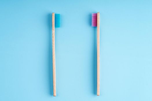 A pair of eco-friendly bamboo toothbrushes. Global environmental trends. Toothbrushes of different genders.