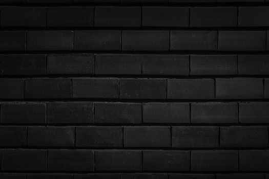 Masonry brick wall black color close-up.Texture or background