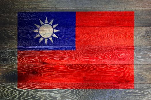 A Taiwan flag on rustic old wood surface background
