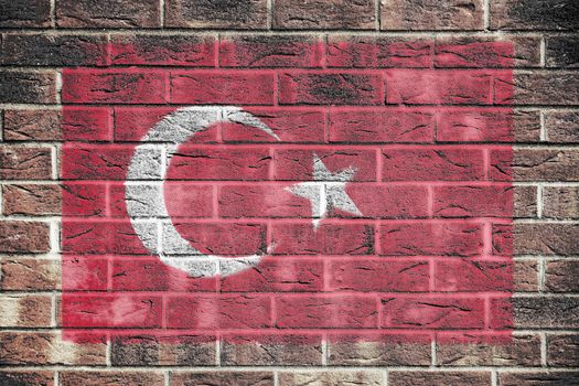 A Turkey flag on a brick wall background