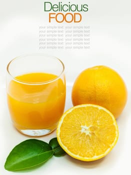 Glass of fresh orange juice with sliced orange .