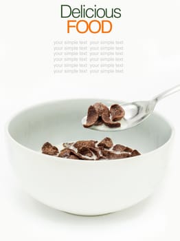 Chocolate cereals with milk isolate on white .