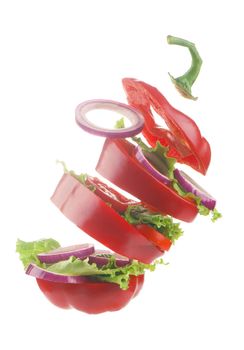 Creative layout made of tomato, bell pepper, cucumber and salad leaves mix