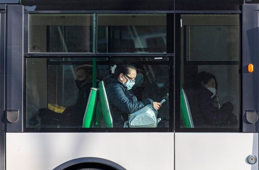 terni,italy february 24 2021:people sitting in the local bus