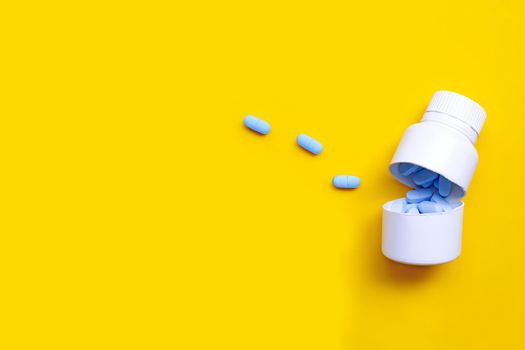 PrEP ( Pre-Exposure Prophylaxis) used to prevent HIV with white plastic medical bottle on yellow background. Copy space