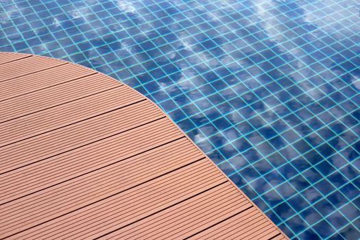 Swimming pool with wooden deck floor