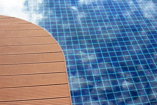 Swimming pool with wooden deck floor