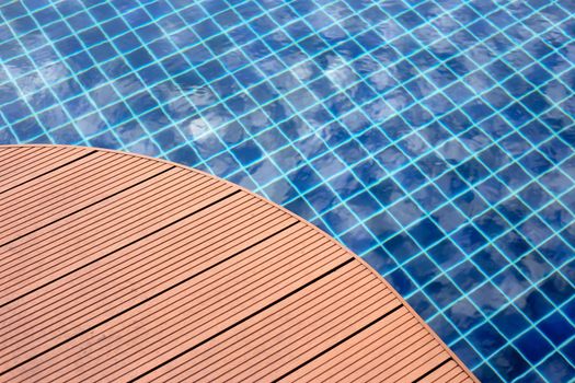 Swimming pool with wooden deck floor