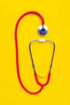 Stethoscope on yellow background. copy space