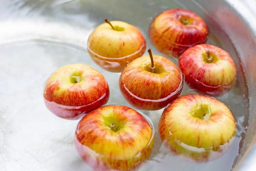 Washing fresh apples in the water