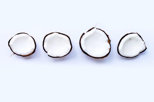 Ripe coconuts on white background. Top view of tropical fruit.