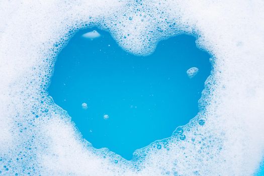 Frame made of detergent foam bubble. heart shape