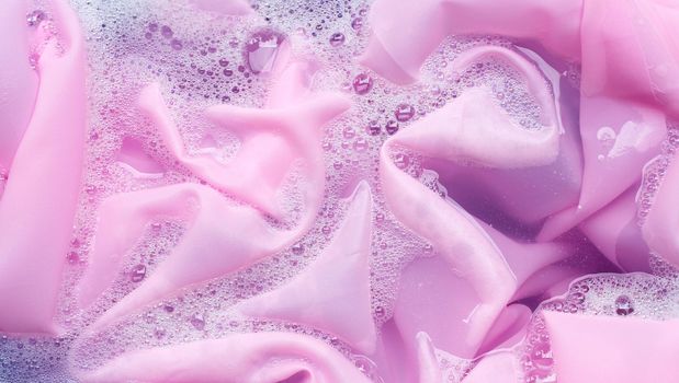 Color clothes soak in powder detergent water dissolution. Laundry concept