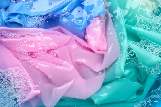 Color clothes soak in powder detergent water dissolution. Laundry concept