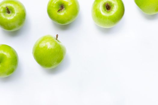 Green apples on white background. Copy space
