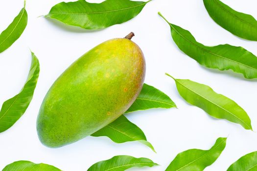 Tropical fruit, Green mango with leaves on white background. Top view
