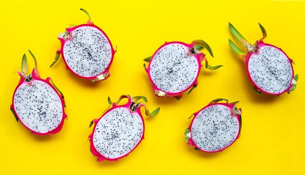 Ripe dragonfruit or pitahaya on yellow background. Top view