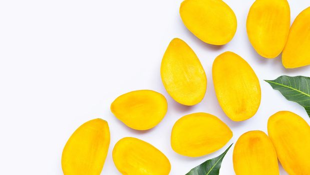 Tropical fruit, Mango slices with leaves on white background. Top view