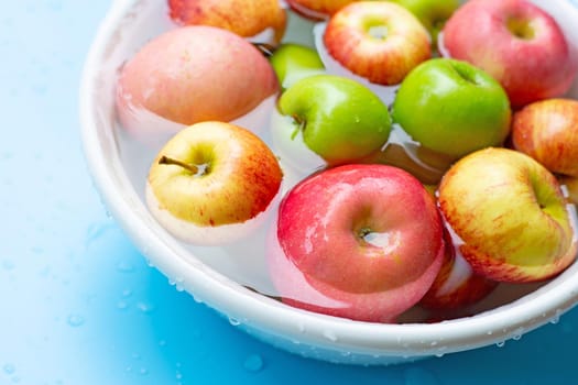 Washing fresh apples in the water