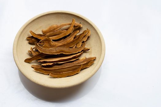Dried lingzhi mushroom slices on white background