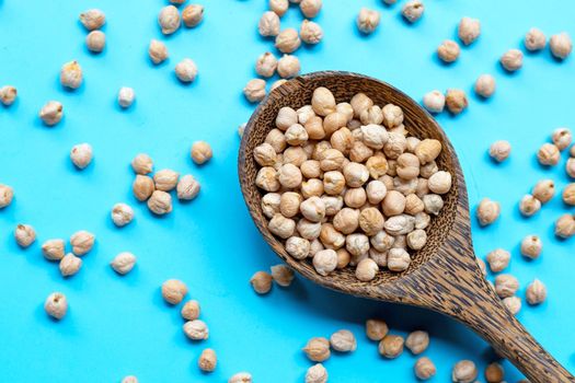 Chickpeas on blue background. Top view