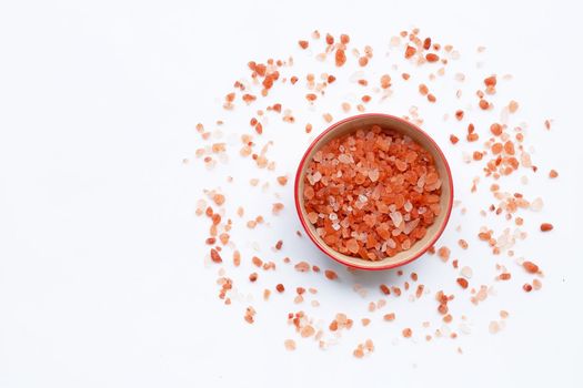 Pink himalayan salt in white background.