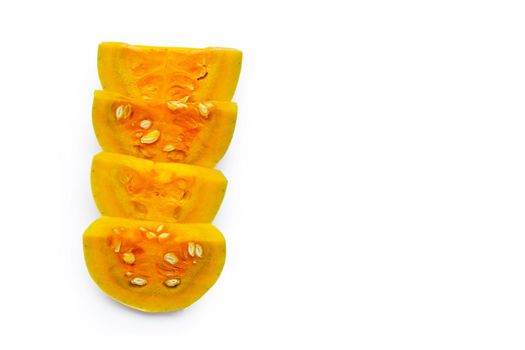 Cut and slices butternut squash on white background.