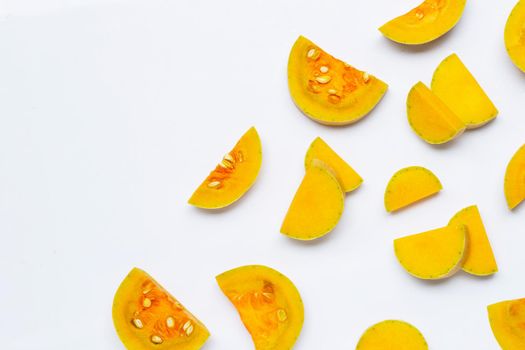 Cut and slices butternut squash on white background.