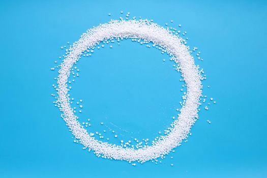 Chemical plant urea fertilizer on blue background.